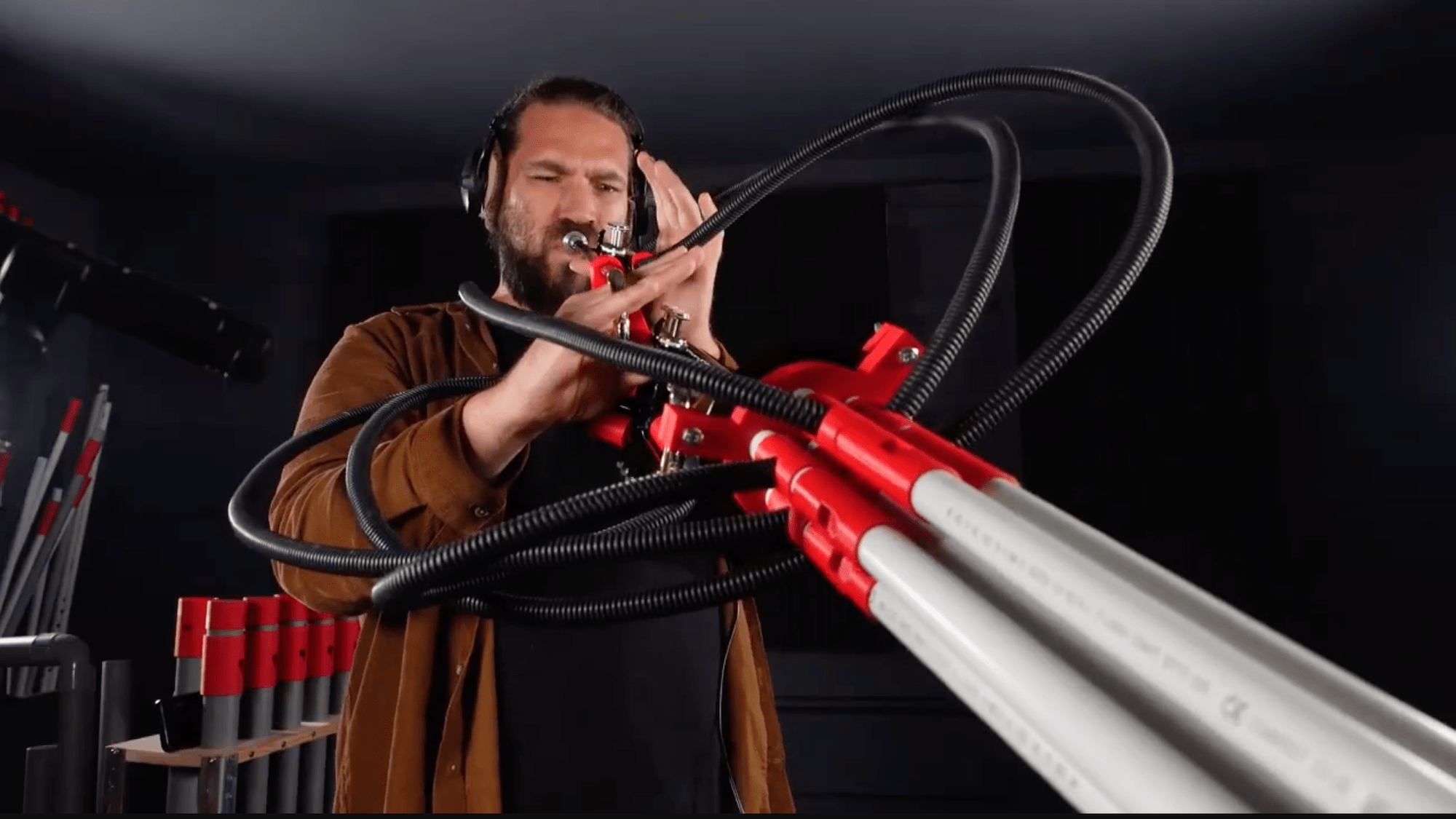 Man playing double trumpet instrument