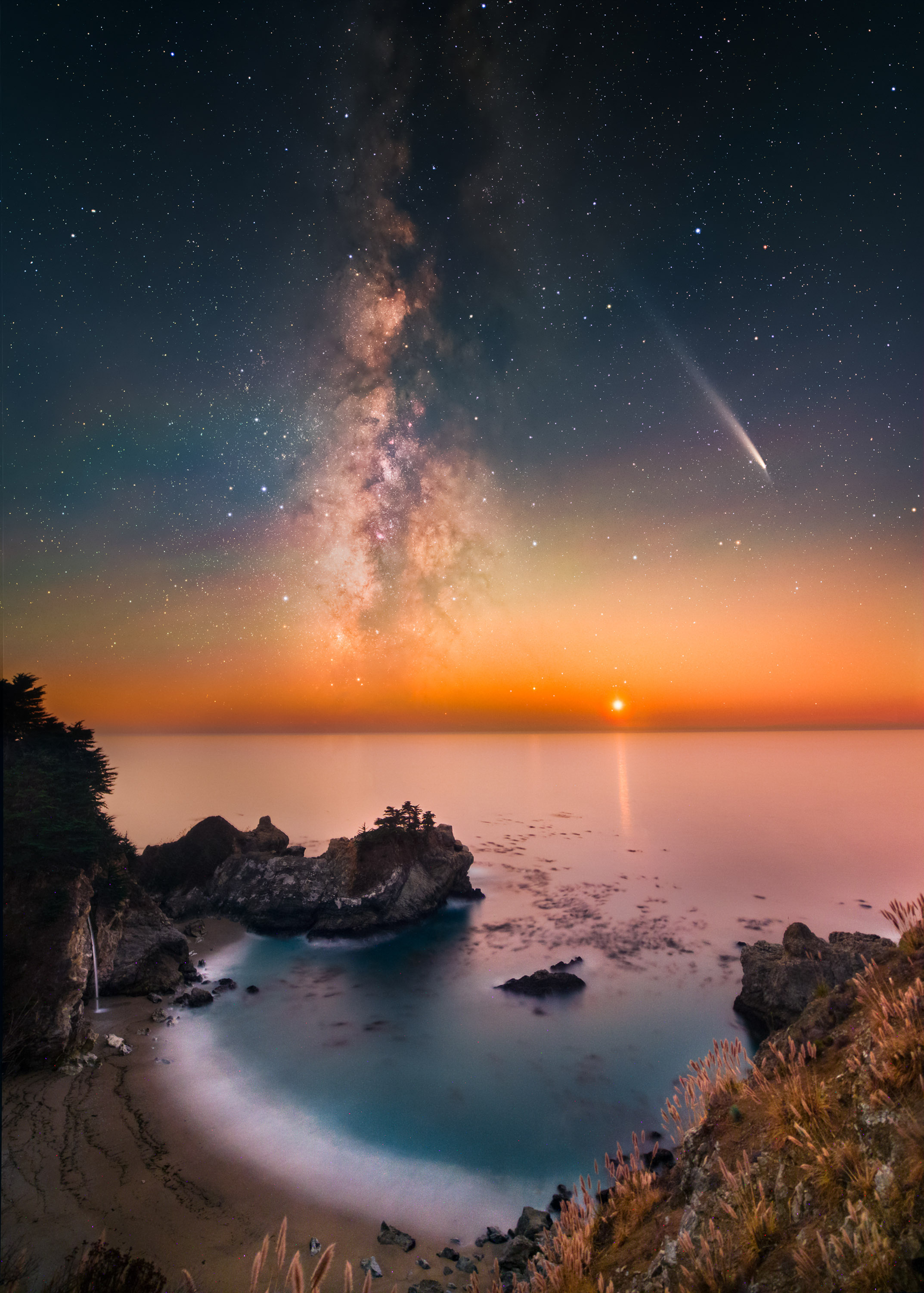 stars and a shooting star at sunset on a beach