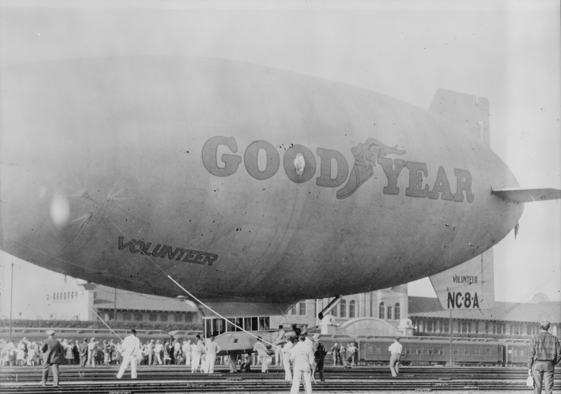 The Goodyear Blimp Volunteer lands at a California railroad station in 1929.