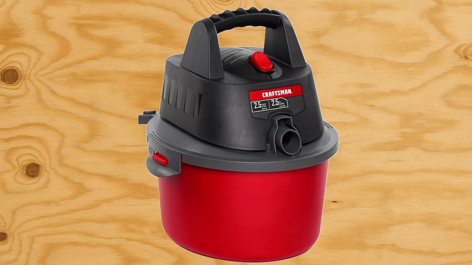  A Craftsman shop vac in front of plywood.