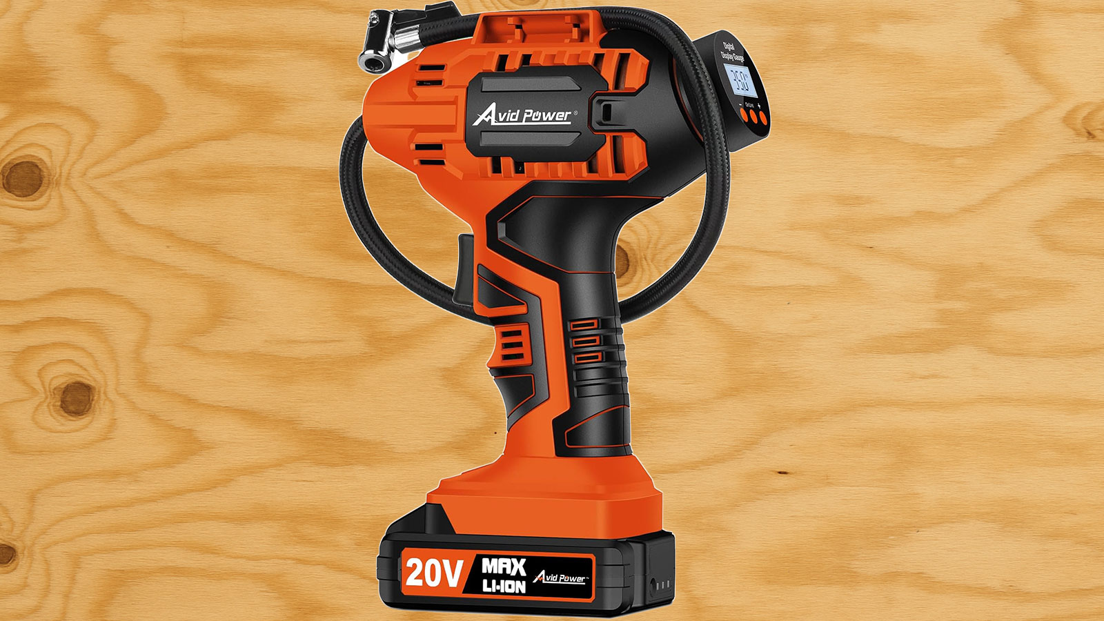  An Avid tire inflator in front of plywood.