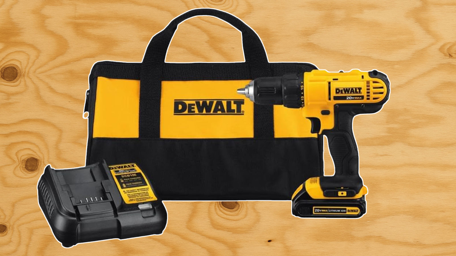  A DeWalt drill/driver with its battery and bag in front of plywood.