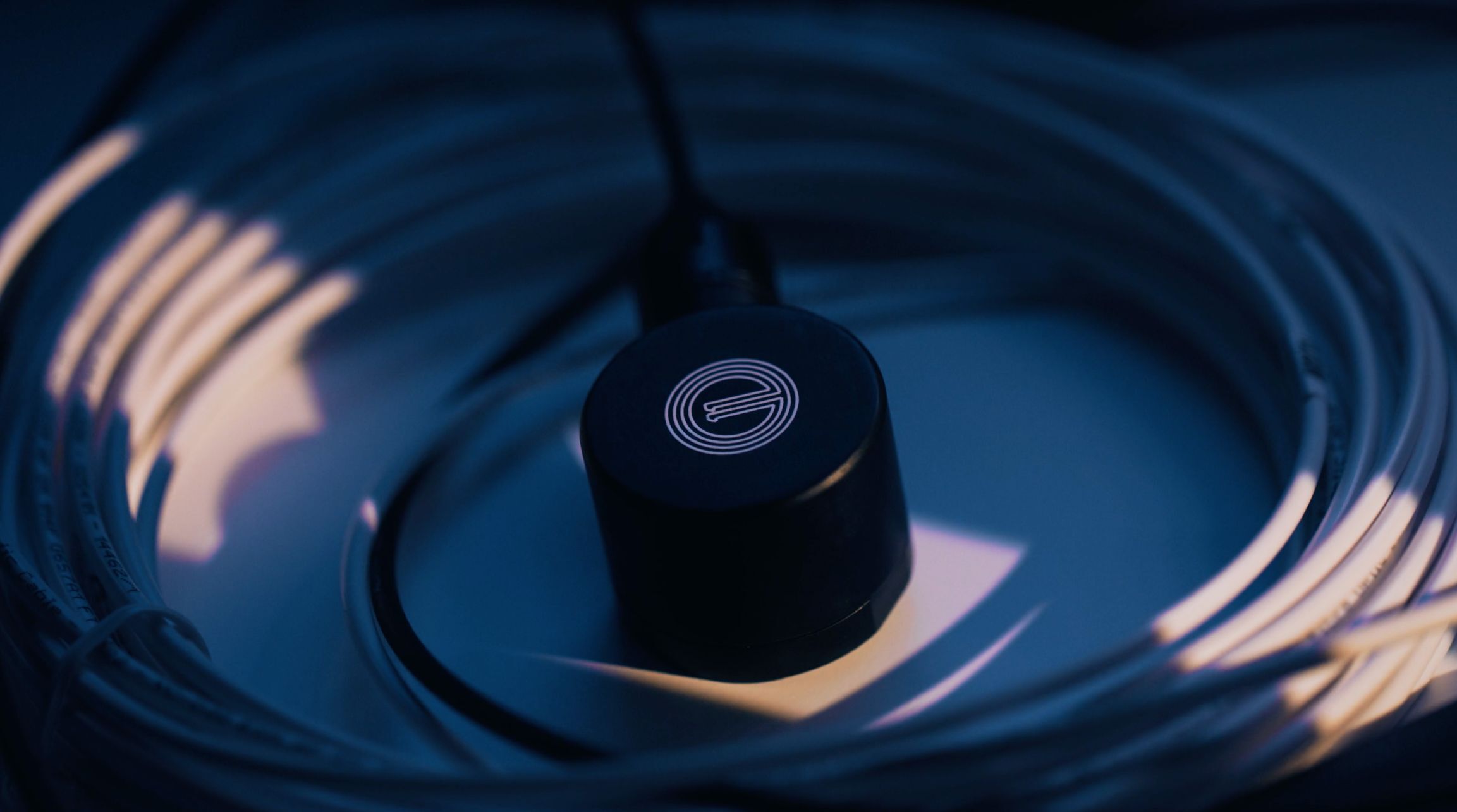 a black, round censor
