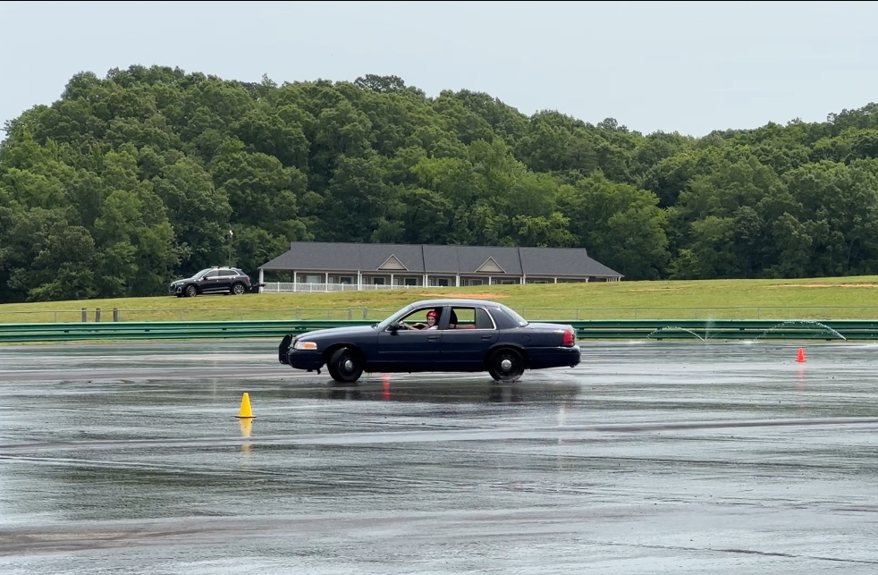 black car on wet pavement