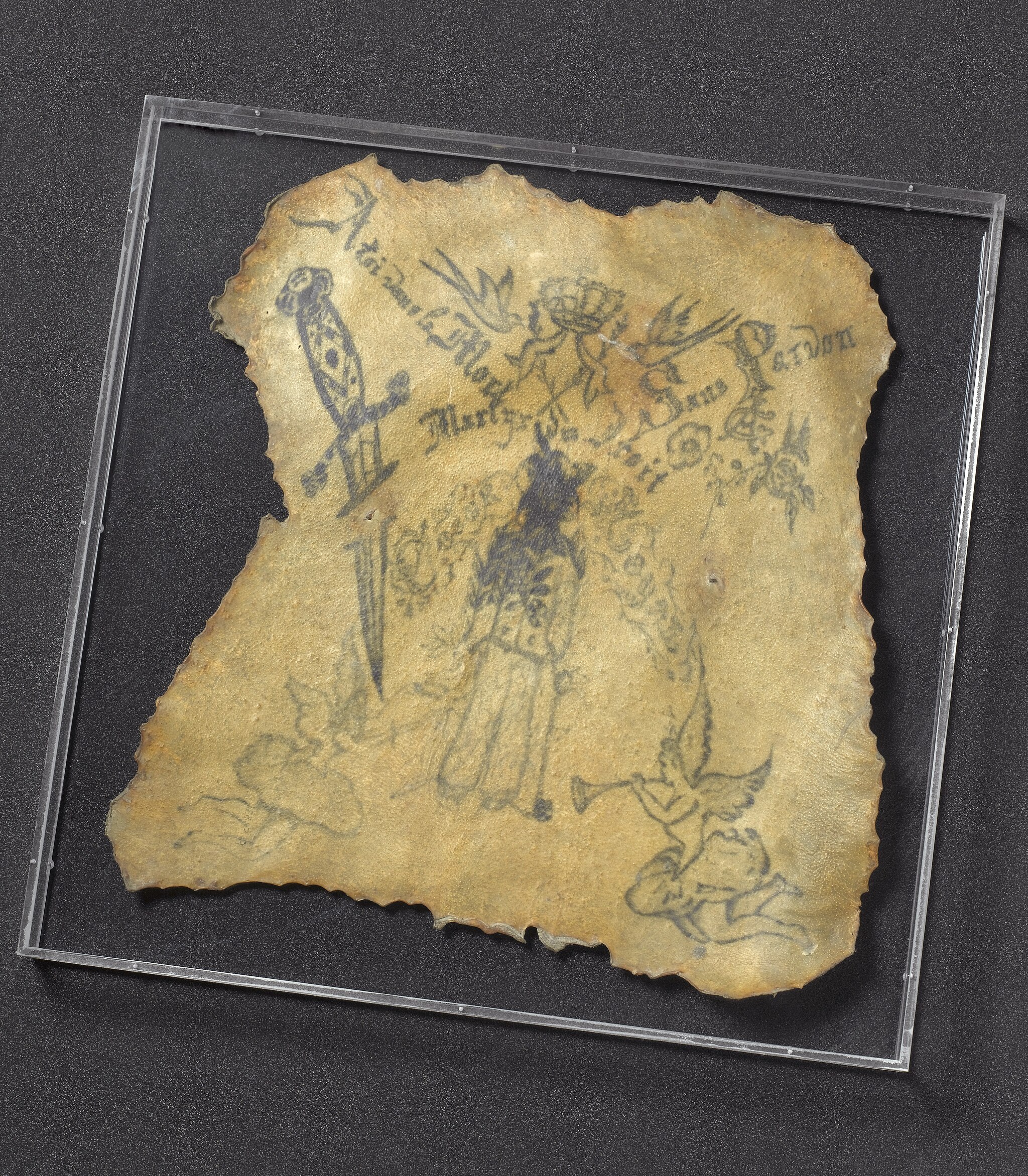 Tattooed with a figure of a man with a large dagger surrounded by female angels with trumpets