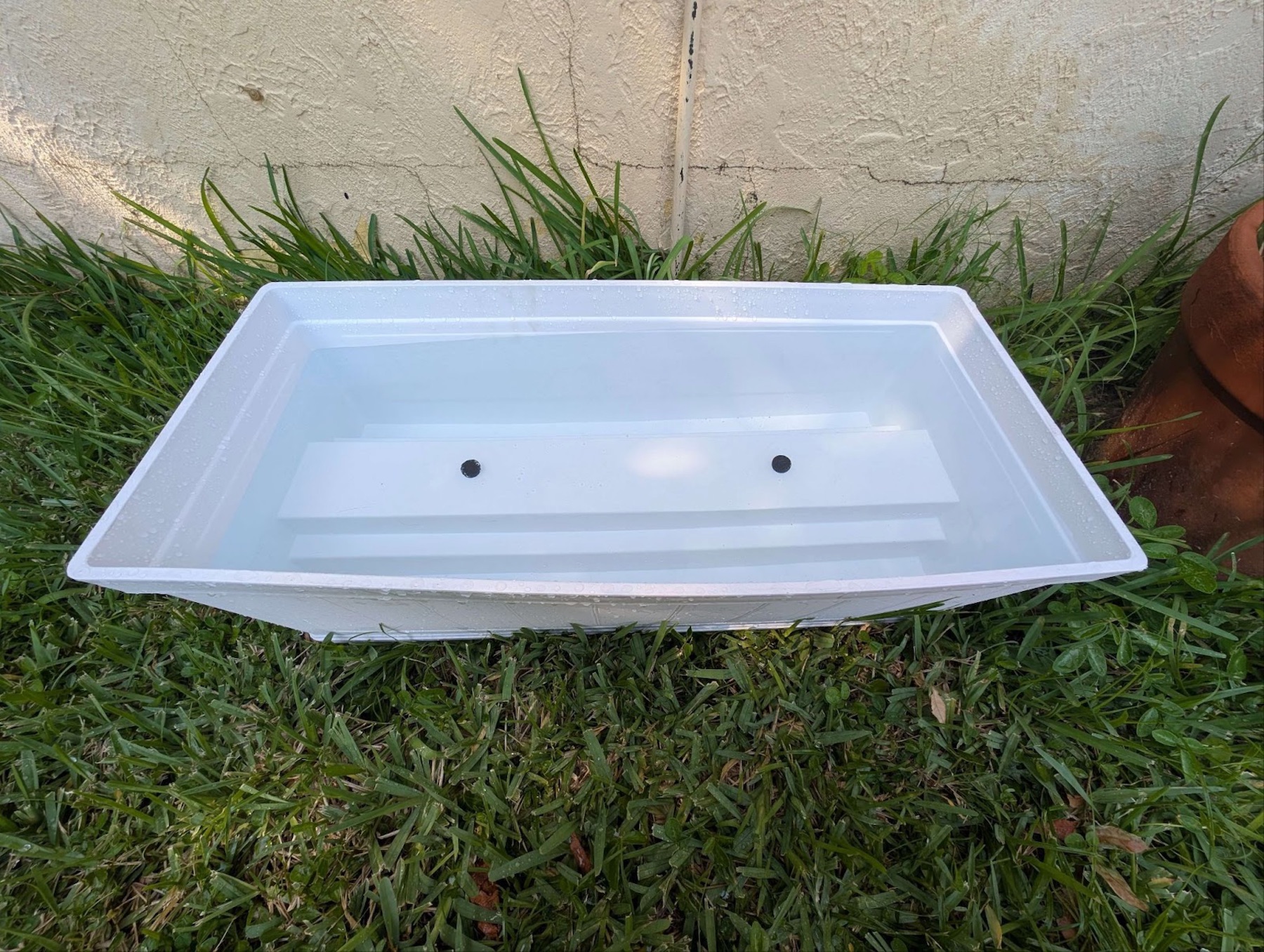 a planter sitting in grass