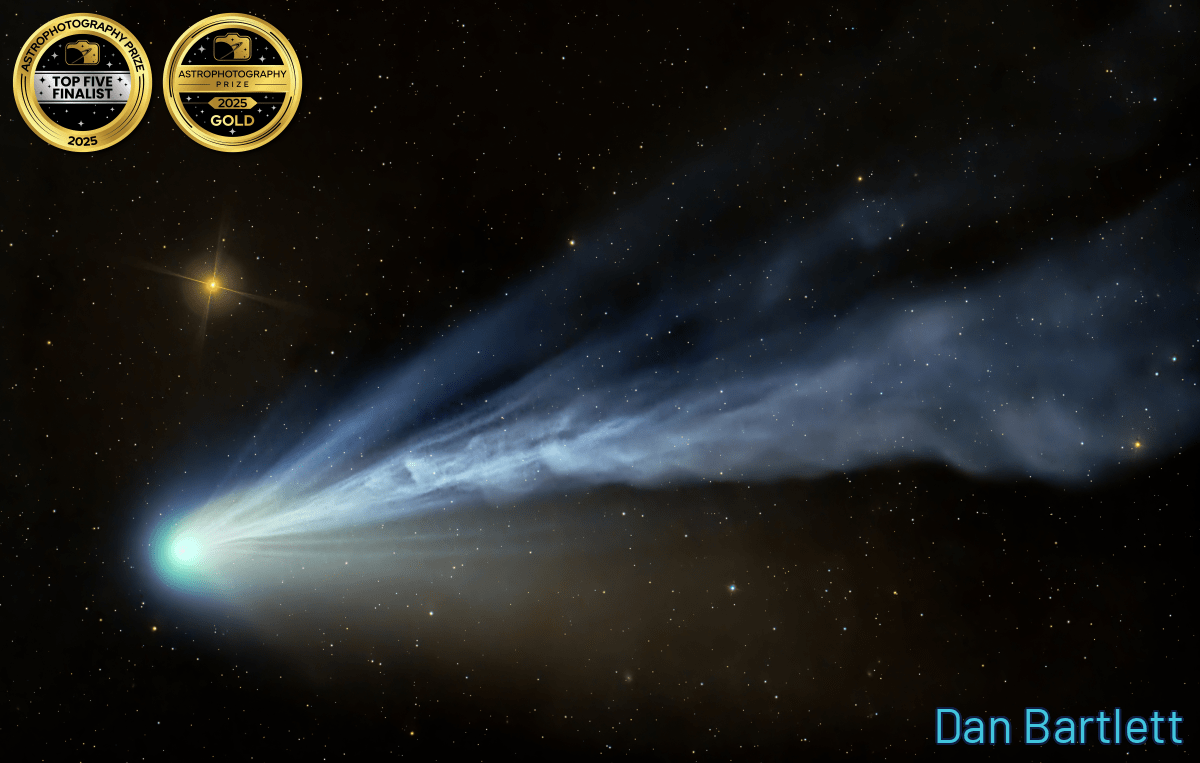 a blue-green comet streaking across the sky
