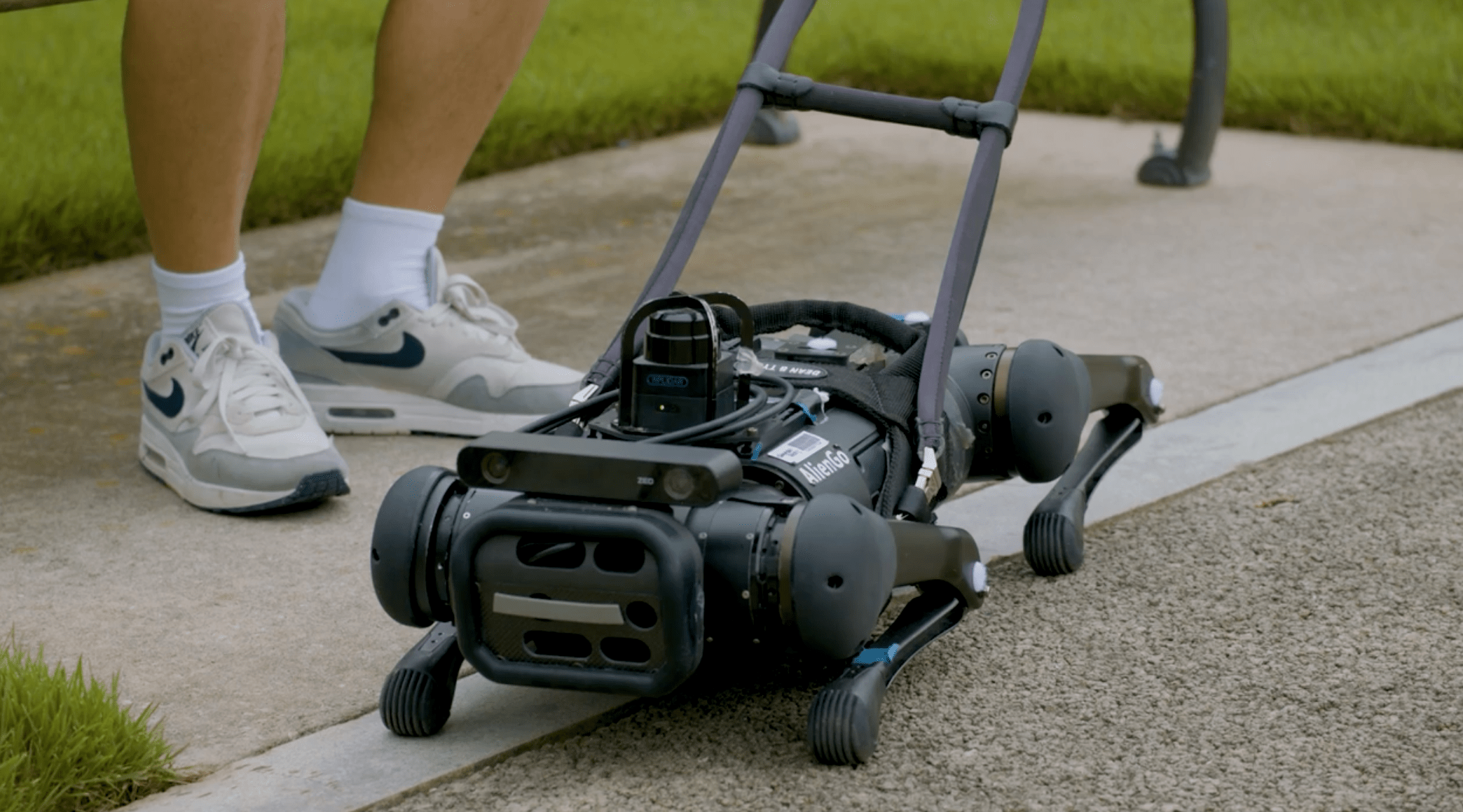 a robot dog laying on the ground