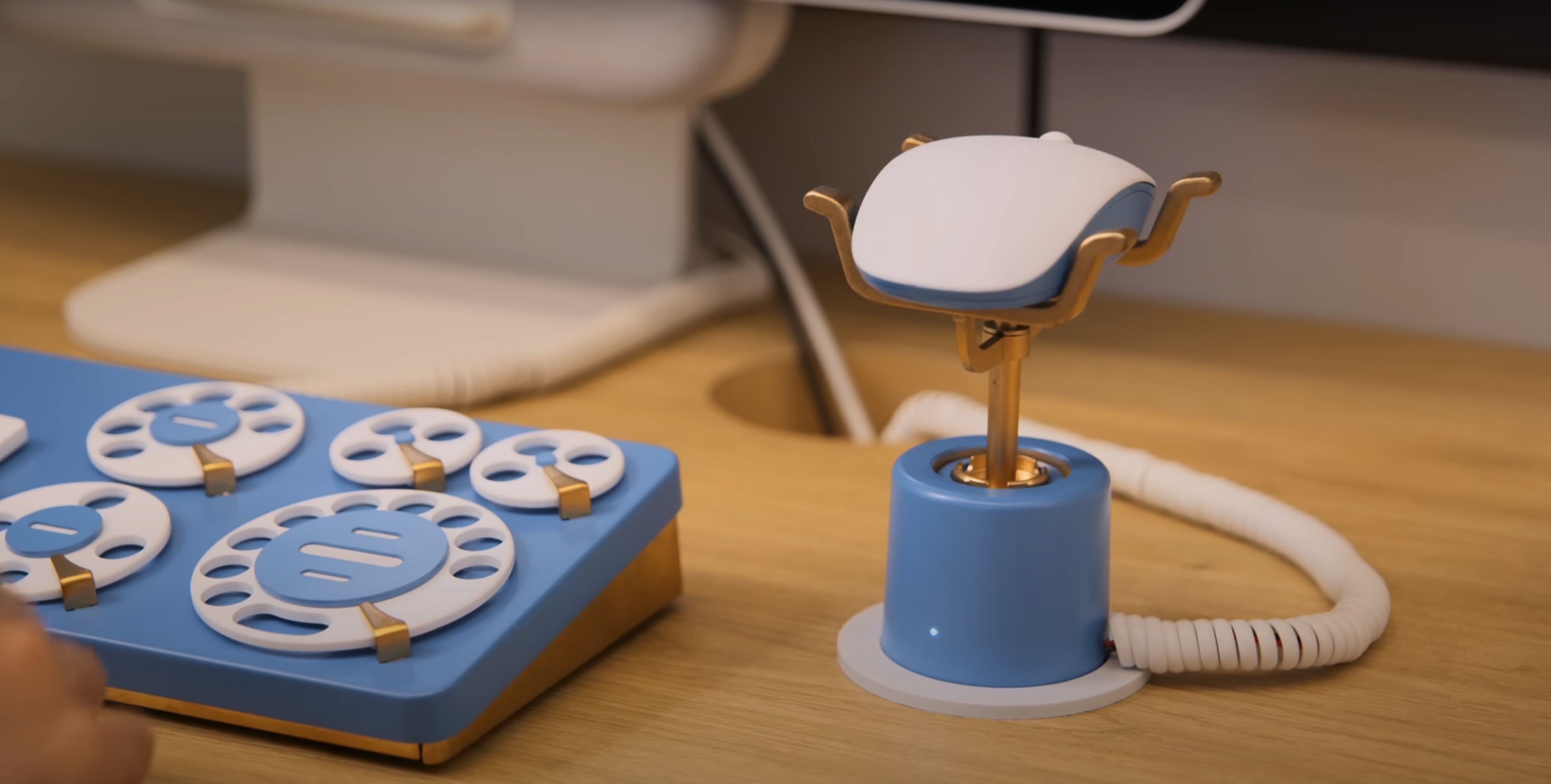 a panel of rotary dials and a stand with a mouse