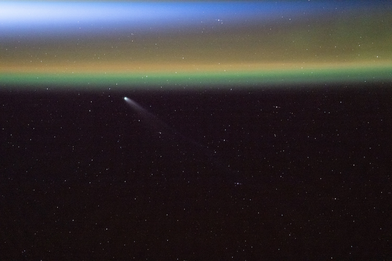 Comet passing over Earth's aurora seen from ISS