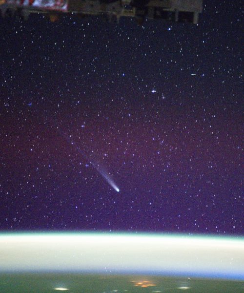 ISS astronauts photograph two comets soaring over Earth’s auroras