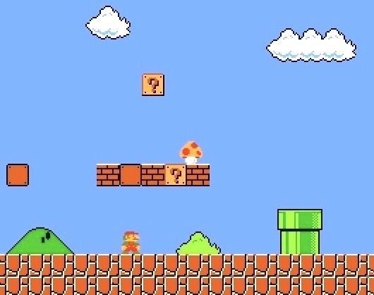 Small Mario uncovering the first super mushroom power-up in World 1-1in Super Mario Bros. Screenshot: supermarioplay.com.