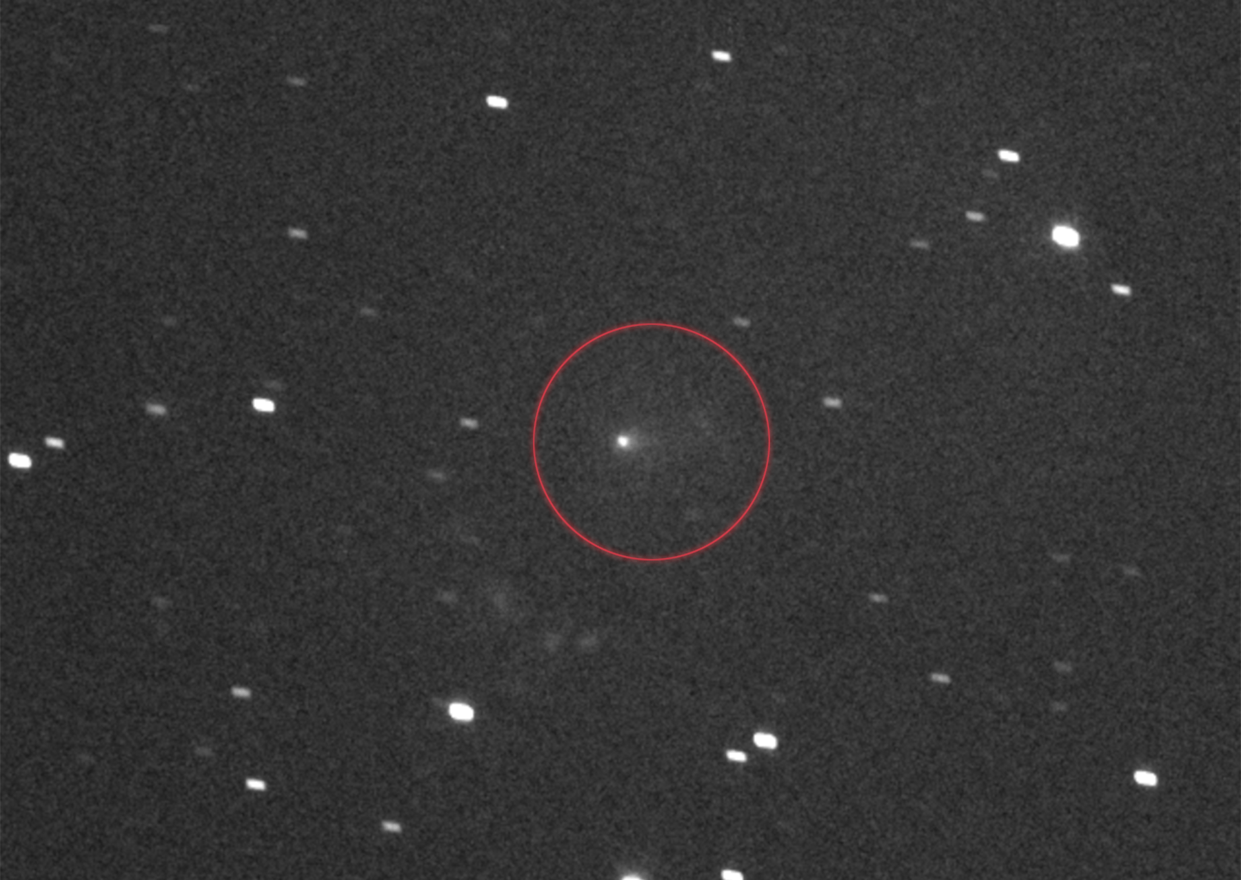 a black and white photo of a comet