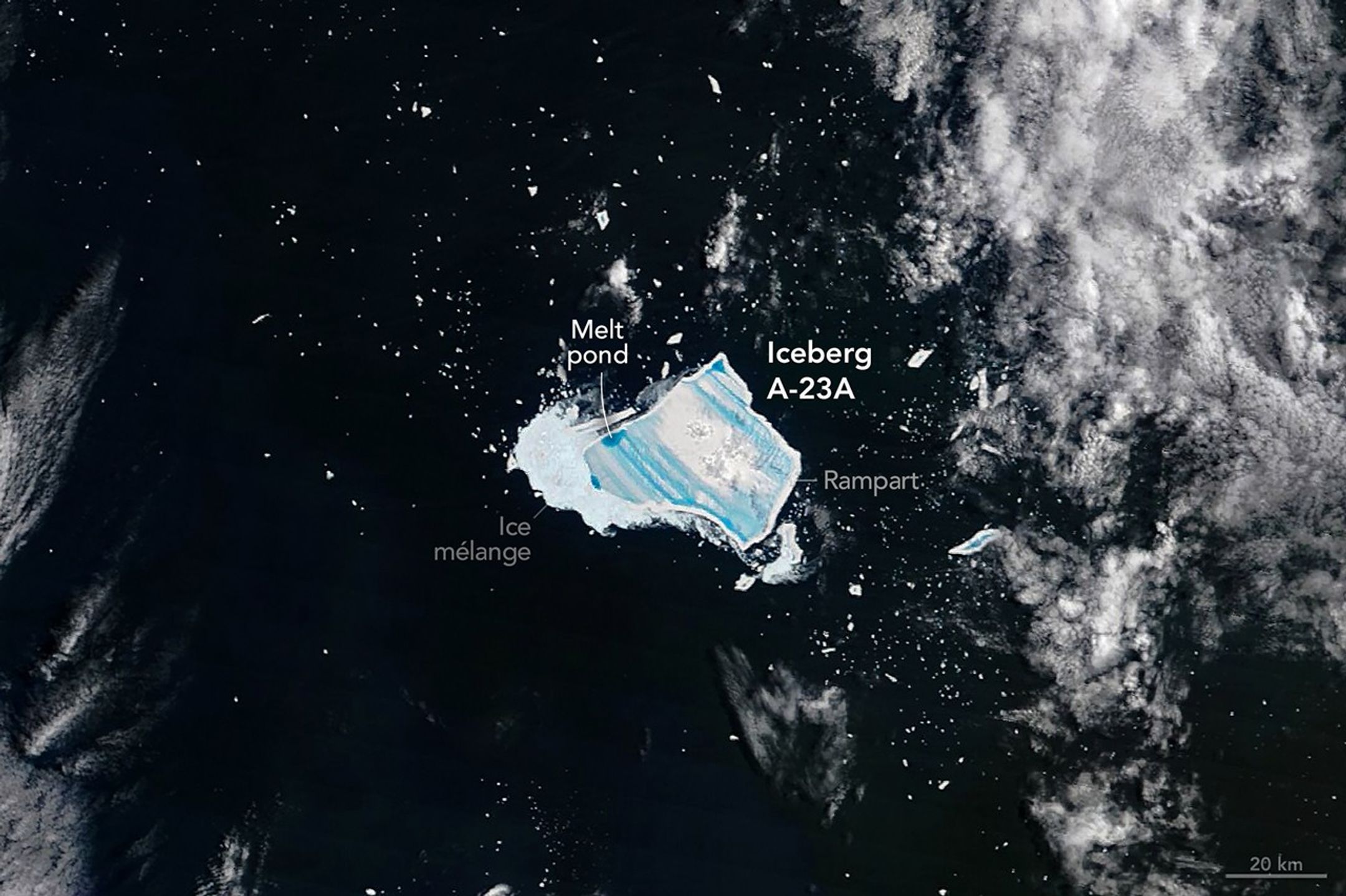 The satellite image of iceberg A-23A taken on December 26, 2025. it shows large blue streaks that are pools of melting water