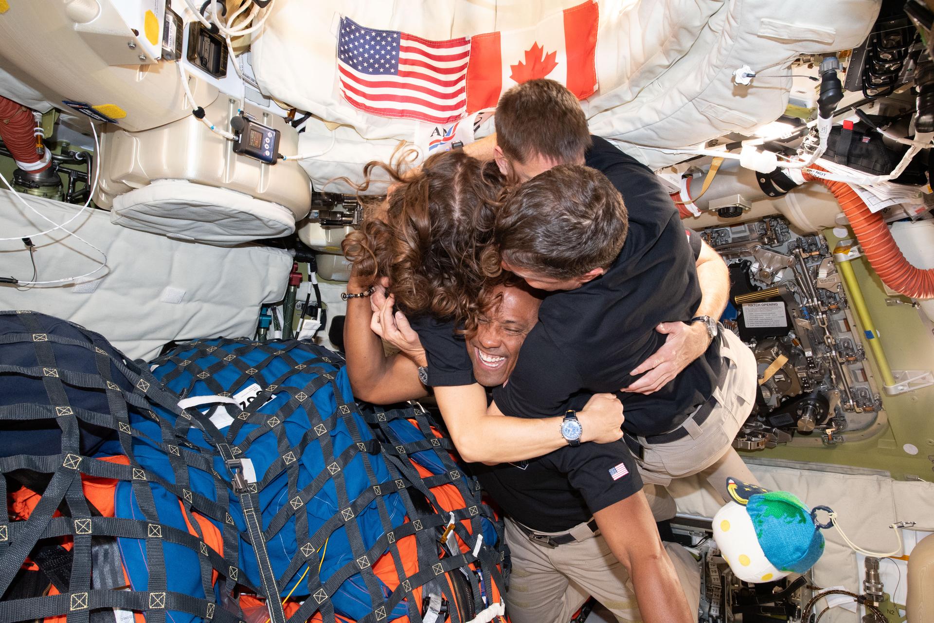 astronauts hug