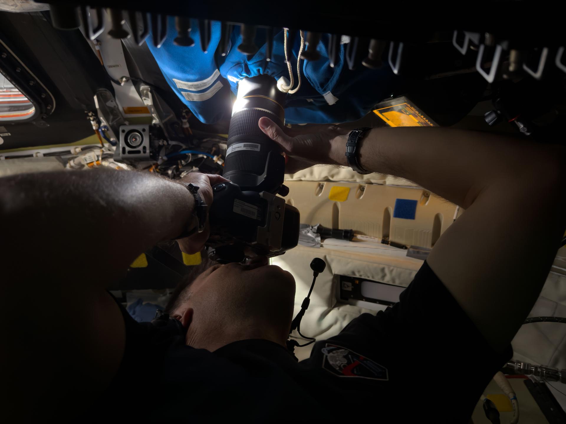Astronaut Jeremy Hansen captures an image through the camera shroud 