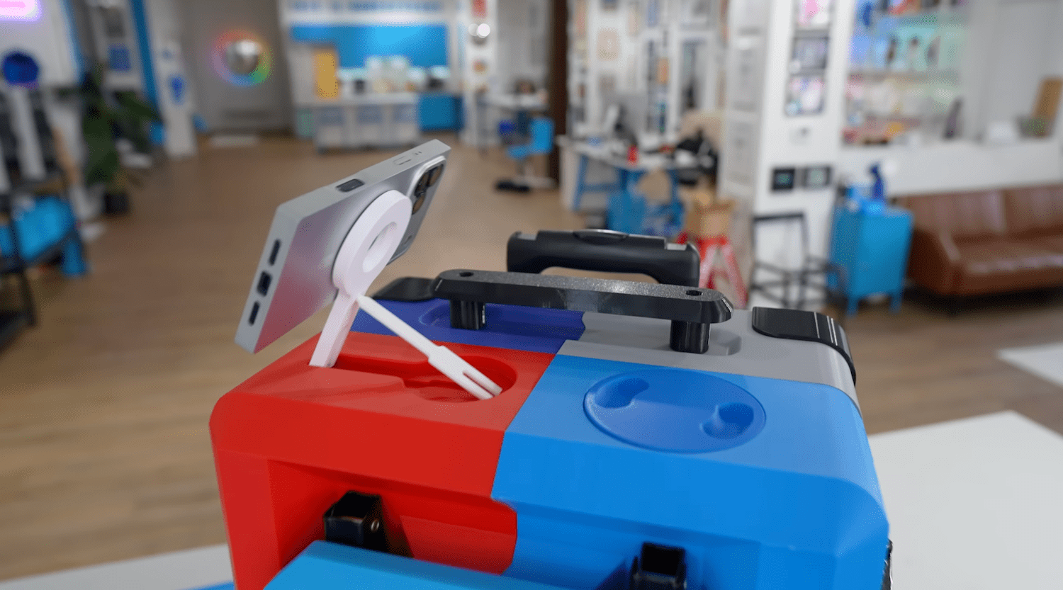 3D printed suitcase with MagSafe phone attachment